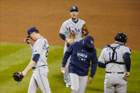 Tampa Bay Rays' Peter Fairbanks, left, leaves the game during the second inning of a baseball game against the New York Mets Monday, Sept. 21, 2020, in New York. (AP Photo/Frank Franklin II)