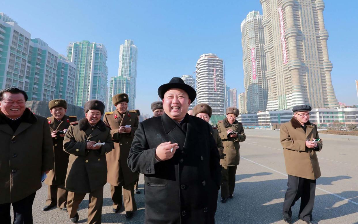 North Korean leader Kim Jong-un enjoys a cigarette while inspecting a construction site in Pyongyang - STR/AFP