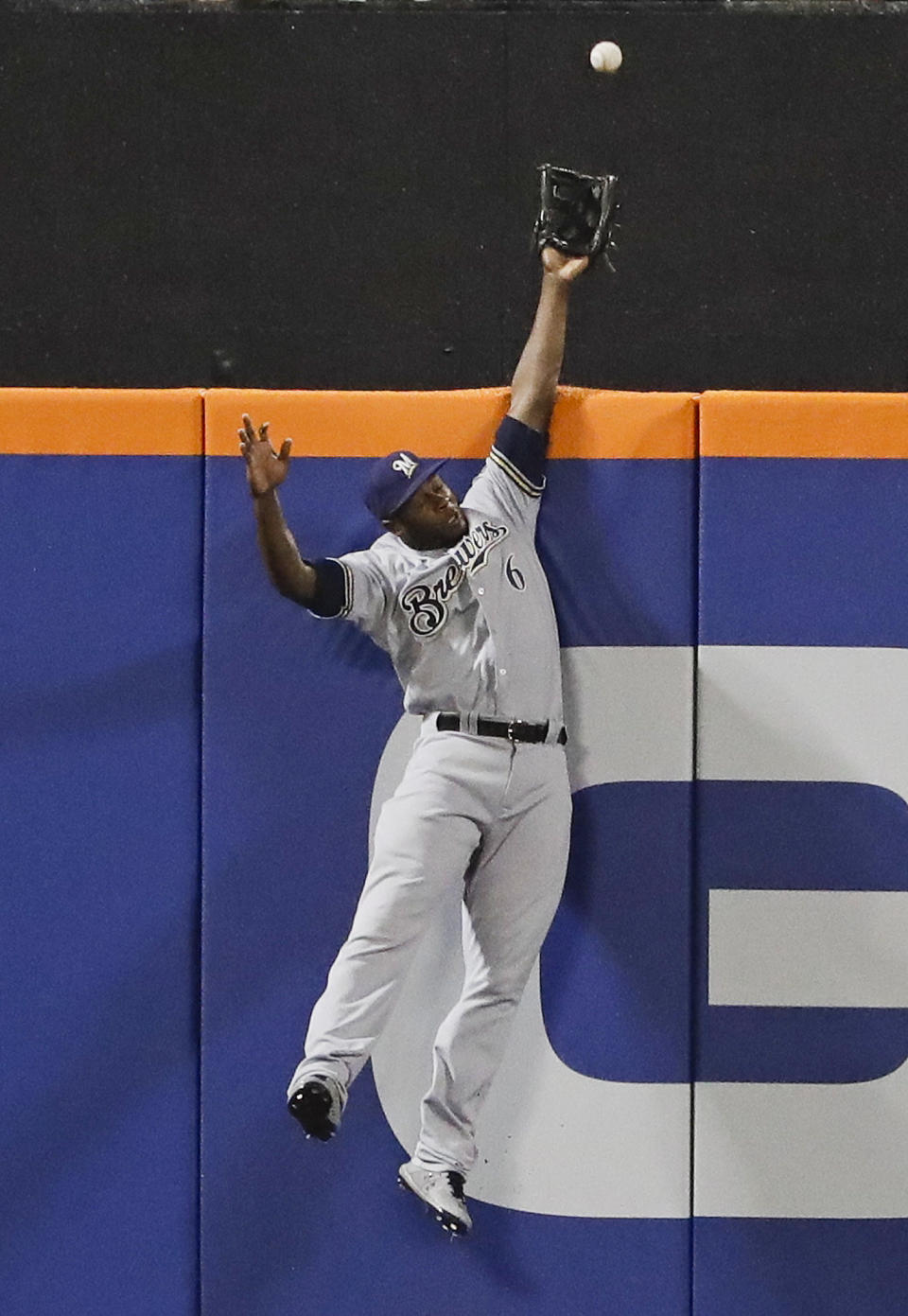 FILE - In this Friday, April 26, 2019 file photo, Milwaukee Brewers center fielder Lorenzo Cain (6) catches a ball hit by New York Mets' Todd Frazier for an out during the second inning of a baseball game in New York. Everyone has seen an outfielder receive a tip of the cap or a jubilant fist bump from a pitcher after a home run robbery. This is a story about what happens after they leave the field. (AP Photo/Frank Franklin II, File)