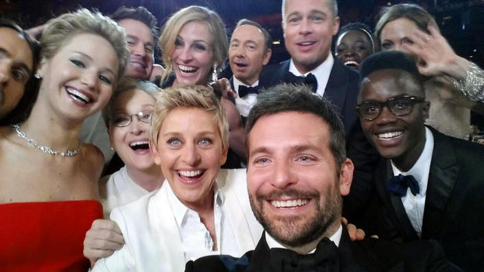 This image released by Ellen DeGeneres shows actors, front row from left, Jared Leto, Jennifer Lawrence, Meryl Streep, Ellen DeGeneres, Bradley Cooper, Peter Nyong’o Jr. and, second row, from left, Channing Tatum, Julia Roberts, Kevin Spacey, Brad Pitt, Lupita Nyong’o and Angelina Jolie as they pose for a "selfie" portrait on a cell phone during the Oscars at the Dolby Theatre on Sunday, March 2, 2014, in Los Angeles. (AP Photo/Ellen DeGeneres)