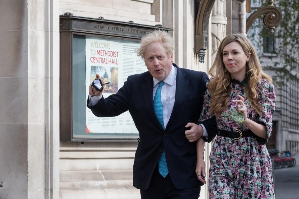 Boris Johnson and Carrie Symonds walk to a polling station at Methodist Central Hall to cast their votesBarcroft Media via Getty Images