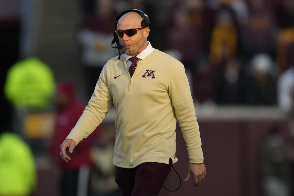 Minnesota head coach P. J. Fleck walks across the field during the second half of an NCAA college football game against Illinois, Saturday, Nov. 4, 2023, in Minneapolis. (AP Photo/Abbie Parr)