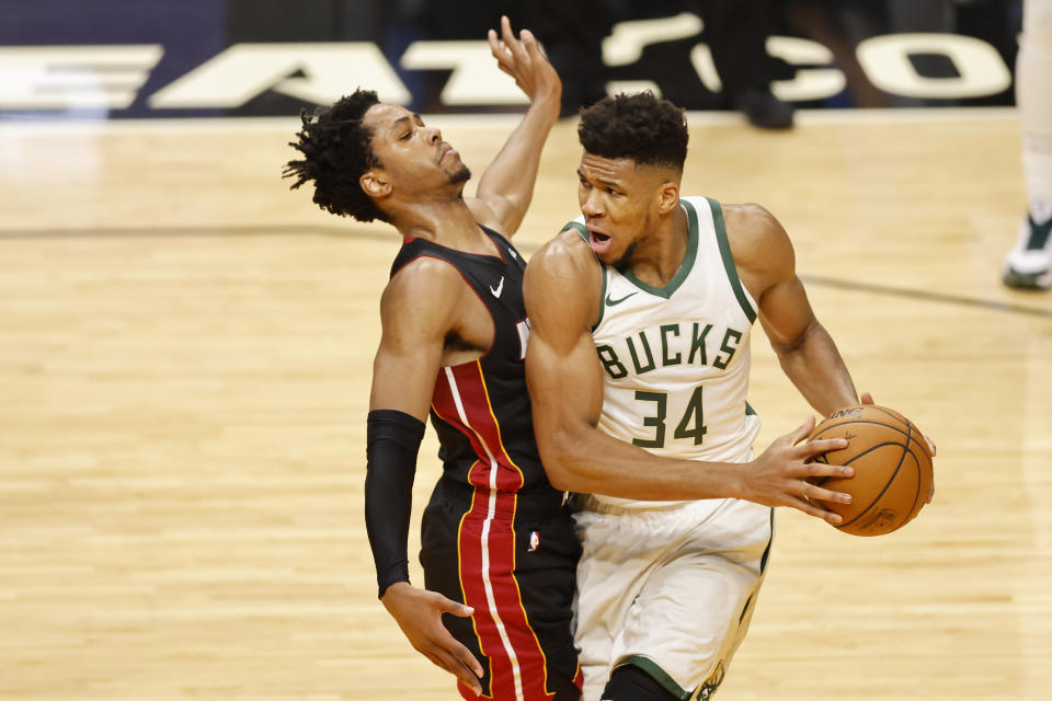 MIAMI, FLORIDA - DECEMBER 29: Giannis Antetokounmpo #34 of the Milwaukee Bucks drives against KZ Okpala #4 of the Miami Heat during the third quarter at American Airlines Arena on December 29, 2020 in Miami, Florida. NOTE TO USER: User expressly acknowledges and agrees that, by downloading and or using this photograph, User is consenting to the terms and conditions of the Getty Images License Agreement.  (Photo by Michael Reaves/Getty Images)