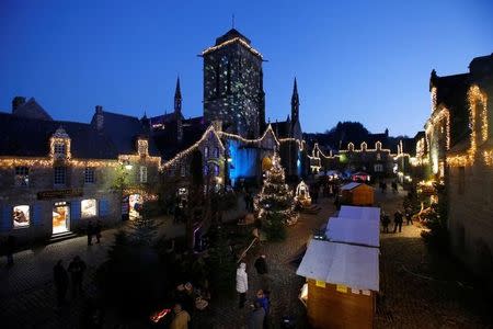 Colored lights are seen as part of illuminations for the Christmas holiday season in Locronan, France, December 16, 2016. REUTERS/Stephane Mahe