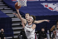 Gonzaga forward Corey Kispert, front, shoots in front of Santa Clara forward Josip Vrankic during the second half of an NCAA college basketball game in Spokane, Wash., Thursday, Feb. 25, 2021. (AP Photo/Young Kwak)