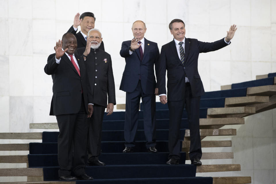 From left to right, South Africa's President Cyril Ramaphosa, China's President Xi Jinping, India's Prime Minister Narendra Modi, Russia's President Vladimir Putin and Brazil's President Jair Bolsonaro pose for a photo at the BRICS emerging economies at the Itamaraty palace in Brasilia, Brazil, Thursday, Nov. 14, 2019. (AP Photo/Pavel Golovkin, Pool)