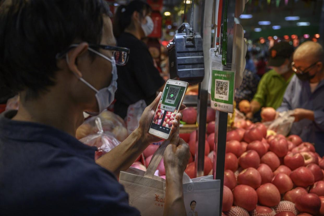 WeChat aims to be everything to everyone but remain mostly in the background. <a href="https://www.gettyimages.com/detail/news-photo/chinese-customer-uses-his-mobile-to-pay-via-a-qr-code-with-news-photo/1228585197" rel="nofollow noopener" target="_blank" data-ylk="slk:Kevin Frayer/Getty Images;elm:context_link;itc:0;sec:content-canvas" class="link ">Kevin Frayer/Getty Images</a>