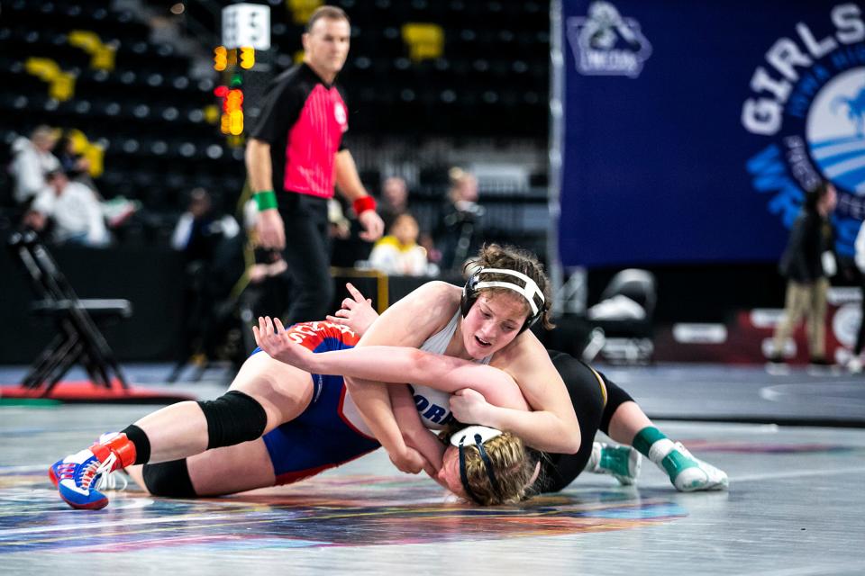 Decorah's Naomi Simon, left, wrestles Southeast Polk's Bella Porcelli at 170 pounds in the finals during of the Iowa Wrestling Coaches and Officials Association (IWCOA) girls' state wrestling tournament, Saturday, Jan. 22, 2022, at the Xtream Arena in Coralville, Iowa.