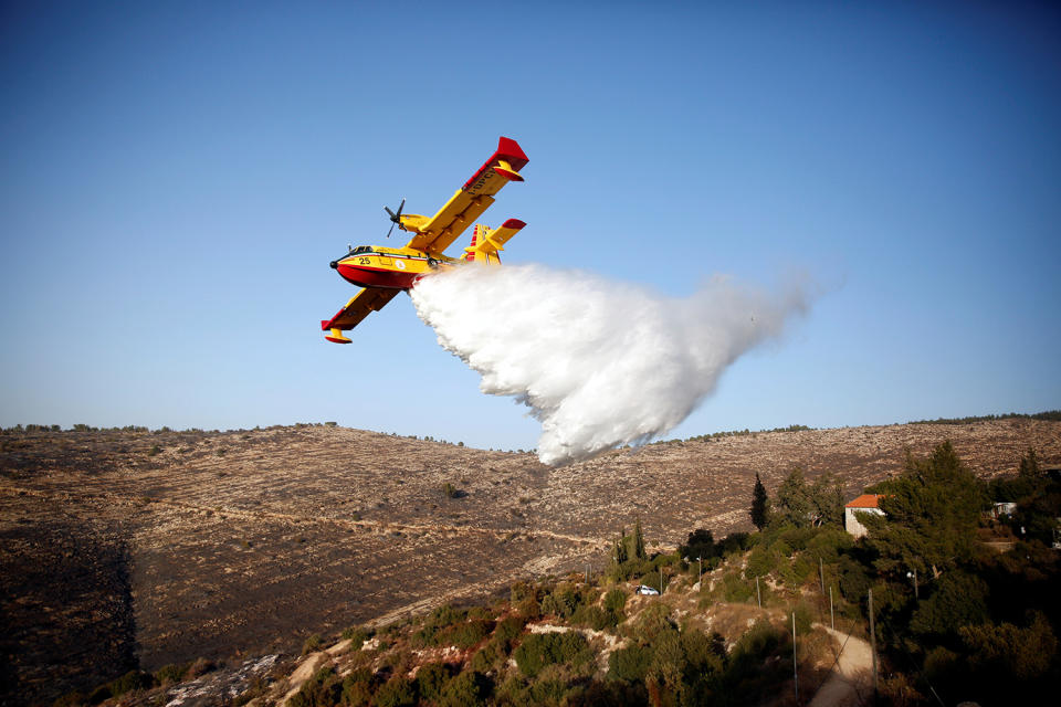 Firefighting plane drops fire retardant