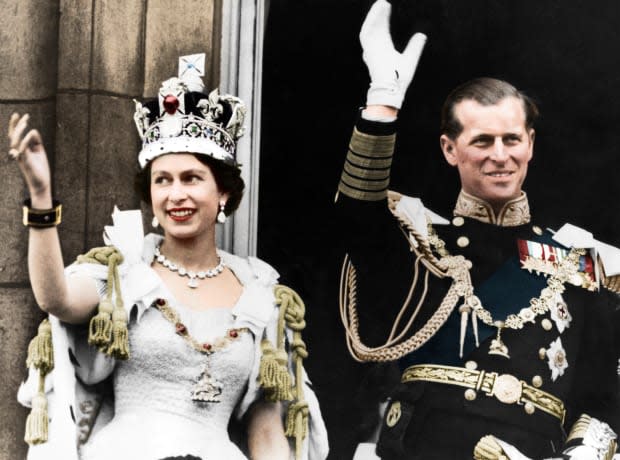 Queen Elizabeth II and the Duke of Edinburgh on the day of their coronation, Buckingham Palace, 1953. (Colorized black and white print). Artist Unknown. (Photo by The Print Collector/Getty Images)<p><a href="https://www.gettyimages.com/detail/924230820" rel="nofollow noopener" target="_blank" data-ylk="slk:Print Collector/Getty Images;elm:context_link;itc:0;sec:content-canvas" class="link ">Print Collector/Getty Images</a></p>