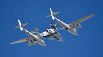 Virgin Galactic rocket plane, the WhiteKnightTwo carrier airplane, with SpaceShipTwo passenger craft takes off from Mojave Air and Space Port in Mojave, California, U.S., February 22, 2019. REUTERS/Gene Blevins