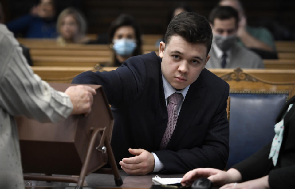 Kyle Rittenhouse pulls numbers of jurors out of a tumbler during his trial at the Kenosha County Courthouse in Kenosha, Wis., on Tuesday, Nov. 16, 2021. The jurors selected through this process will not participate in deliberations. (Sean Krajacic/The Kenosha News via AP, Pool)