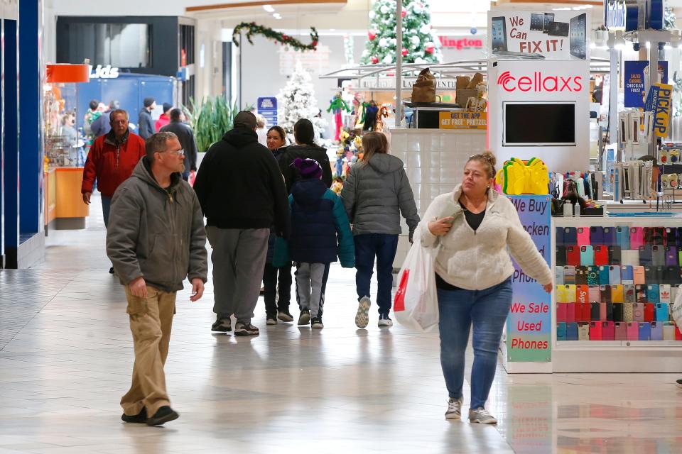 Shoppers are seen walking the main corridor of the Dartmouth Mall.