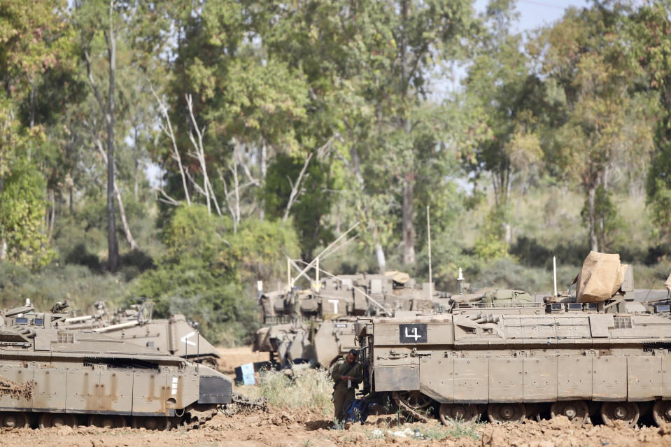 An Israeli soldier stands at a gathering point in Israel Gaza Border, Monday, May 6, 2019. The Israeli army on Monday lifted protective restrictions on residents in southern Israel, while the Hamas militant group's radio station in the Gaza Strip reported a cease-fire, signaling a deal had been reached to end the bloodiest fighting between the two sides since a 2014 war. (AP Photo/Ariel Schalit)