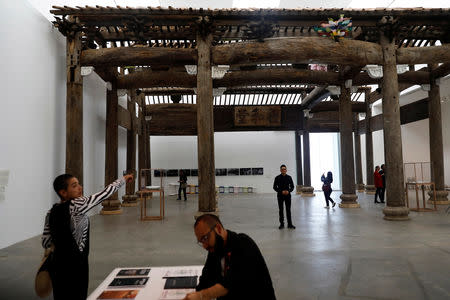 Journalists are seen during a press preview of the exhibition "Restablecer Memorias" by Chinese artist Ai Weiwei displayed at the University Museum of Contemporary Art (MUAC) in Mexico City, Mexico, April 11, 2019. REUTERS/Edgard Garrido/Files