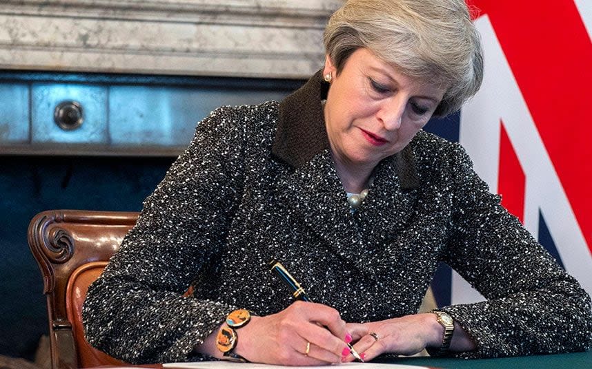 Prime Minister Theresa May signing a letter of notification to the President of the European Council setting out the United Kingdom's intention to withdraw from the European Union  -  JAY ALLEN