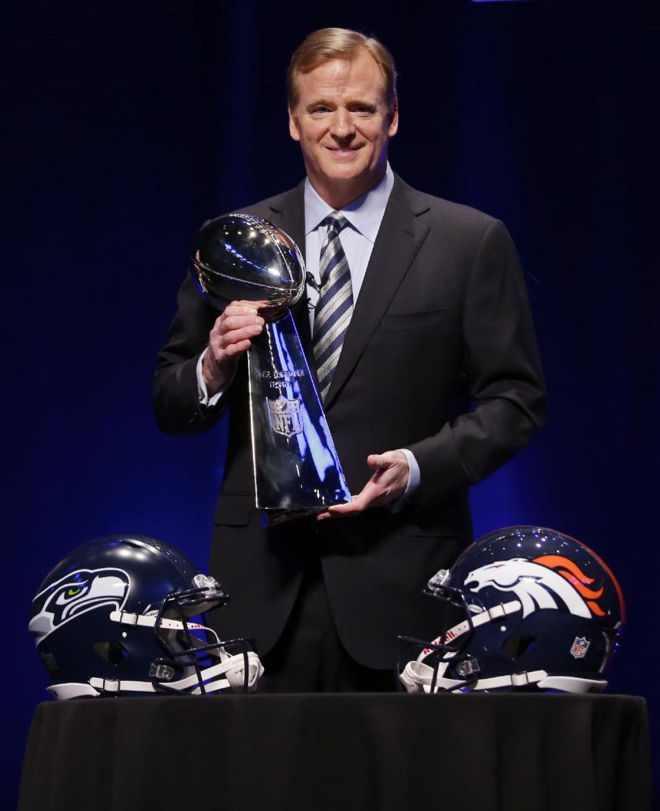 NFL comissioner Roger Goodell holds the Vince Lombardi Trophy at a news conference Friday, Jan. 31, 2014, in New York. The Seattle Seahawks are scheduled to play the Denver Broncos in the NFL Super Bowl XLVIII football game on Sunday, Feb. 2, at MetLife Stadium in East Rutherford, N.J. (AP Photo/Matt Slocum)