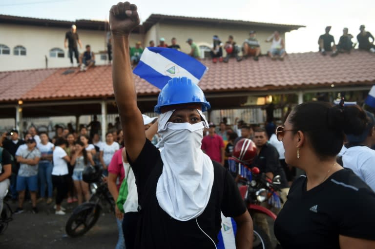 People demonstrate demanding Nicaraguan President Daniel Ortega and his wife, Vice-President Rosario Murillo, step down after deadly unrest