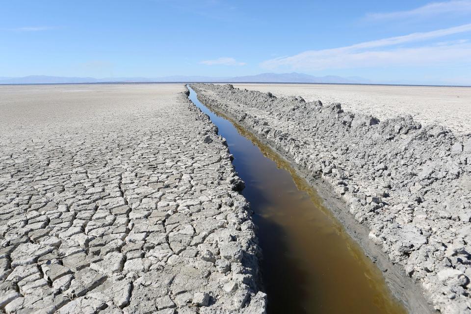 A trench dug to provide water to the Red Hill Bay restoration project shows how far the current shoreline of the Salton Sea has receded in this area that was once covered in water.  The project was started in 2015 to create a shallow water habitat here but has stalled