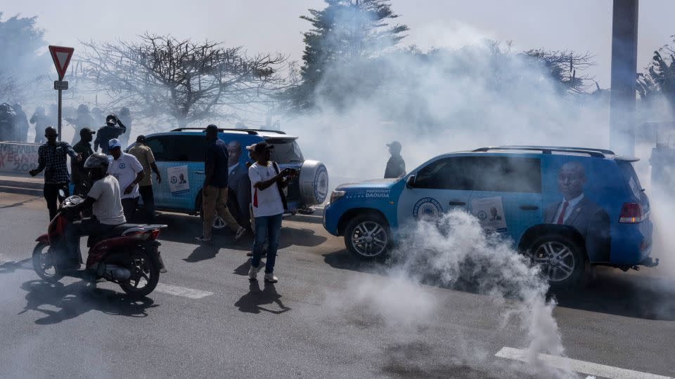 Senegalese riot police lobs tear gas at supporters of opposition presidential candidate Daouda Ndiaye in Dakar, Senegal, Sunday, Feb. 4, 2024. - Stefan Kleinowitz/AP