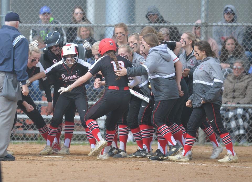 The ROCORI team waits for Madison Terres to reach home after hitting a home run as the No. 1 seed Spartans hosts No. 3 seed Alexandria in the Section 8-3A semifinals on Tuesday, May 31, 2022, at ROCORI High School.  