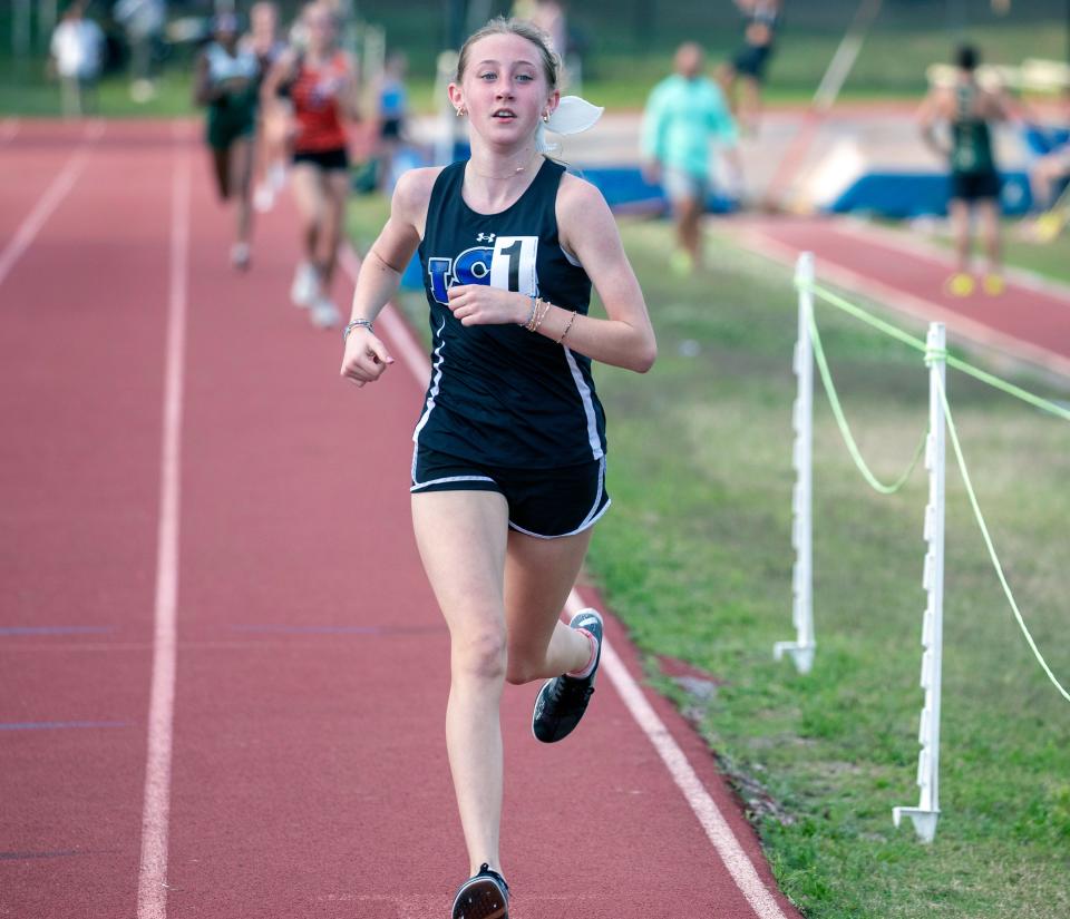 Lakeland Christian's Emma Wilkinson runs to victory in the 1,600 on Tuesday in the Lakeland City Meet. She also won the 3,200.