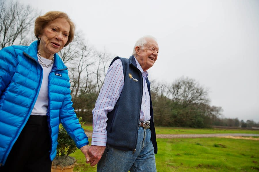 FILE – In this Feb. 8, 2017, file photo former President Jimmy Carter, right, and his wife Rosalynn arrive for a ribbon cutting ceremony for a solar panel project on farmland he owns in their hometown of Plains, Ga Jimmy and Rosalynn Carter have been best friends and life mates for nearly 80 years. Now with the former first lady’s death at age 96, the former president must adjust to life without the woman who he credits as his equal partner in everything he accomplished in politics and as a global humanitarian after their White House years.(AP Photo/David Goldman, File)