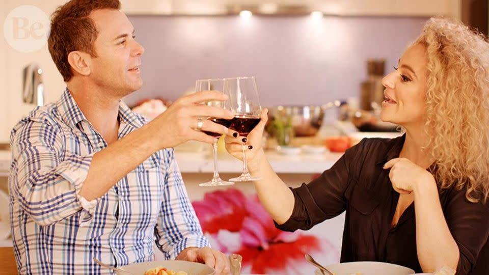 Cheers! Ash Pollard and Wayne Carey tuck into the final dish.