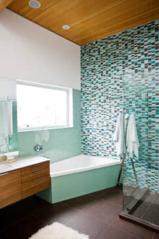 B7B47X Brown and turquoise bathroom, home, decor, tile, shower, towel, window, sink, soap, counter, clean, rug