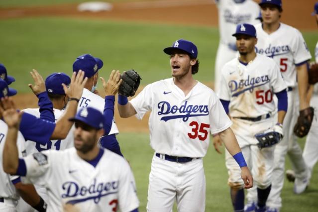 Los Angeles Dodgers' Mookie Betts scores on a fielders choice by Max Muncy  during the fifth inning in Game 1 of the baseball World Series against the  Tampa Bay Rays Tuesday, Oct.