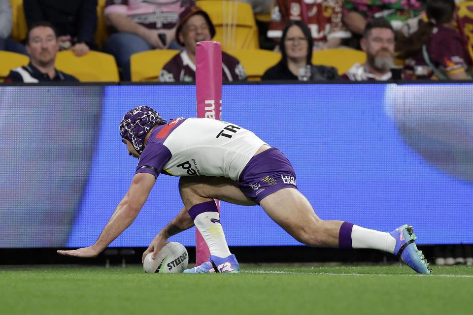 BRISBANE, AUSTRALIA - SEPTEMBER 05: Jahrome Hughes of the Storm scores a try during the round 27 NRL match between Brisbane Broncos and Melbourne Storm at Suncorp Stadium, on September 05, 2024, in Brisbane, Australia. (Photo by Russell Freeman/Getty Images)