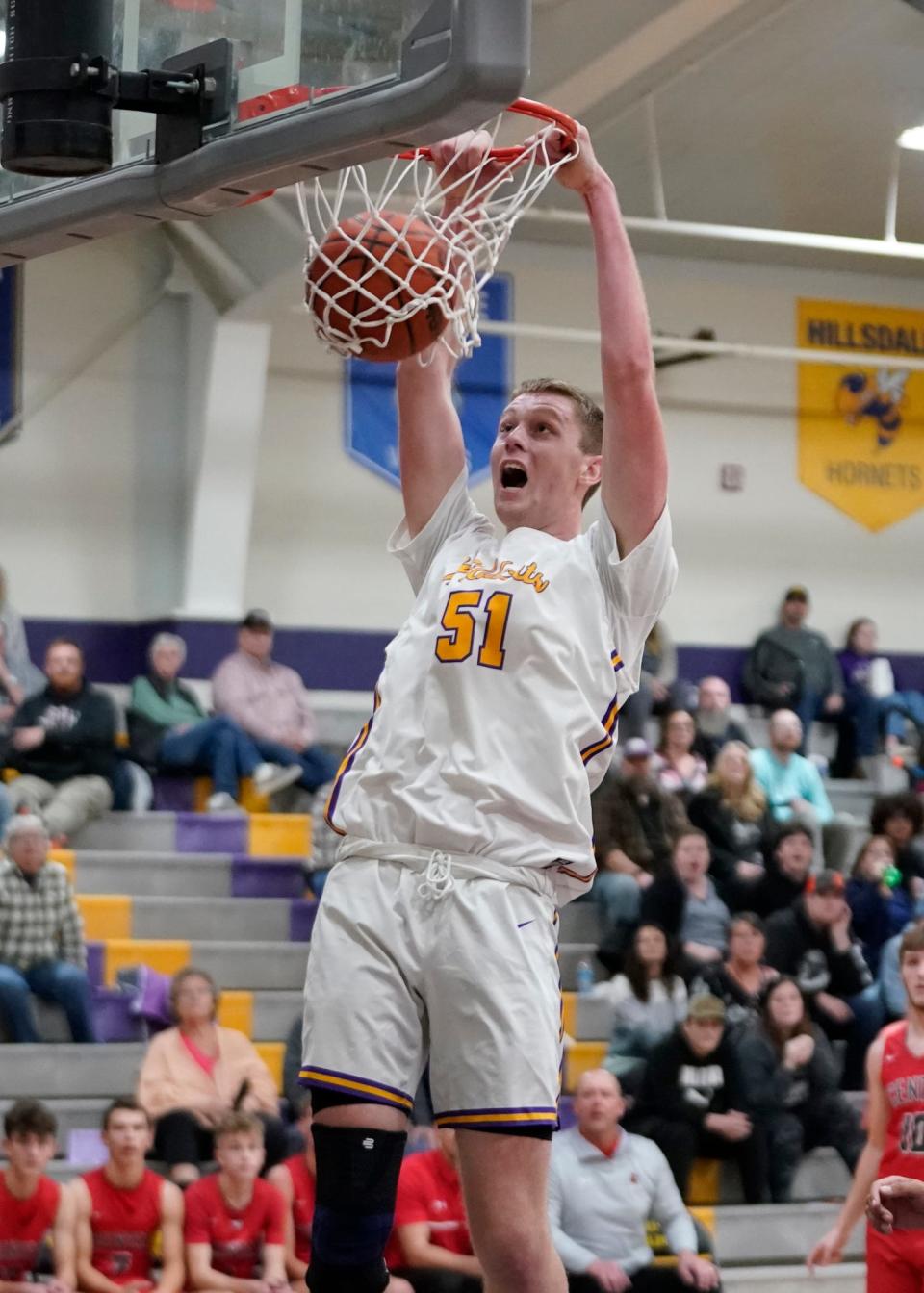 Onsted's Ayden Davis dunks the ball during a game against Michigan Center in the 2022-23 season.