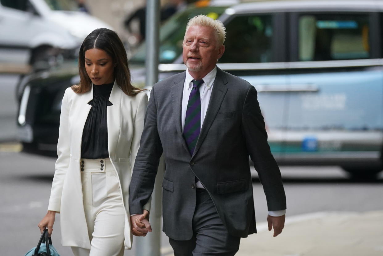 Three-time Wimbledon champion Boris Becker, arrives alongside partner Lilian de Carvalho Monteiro, for sentencing at Southwark Crown Court, in London, after he was found guilty of four charges under the Insolvency Act during his bankruptcy trial. Picture date: Friday April 29, 2022.