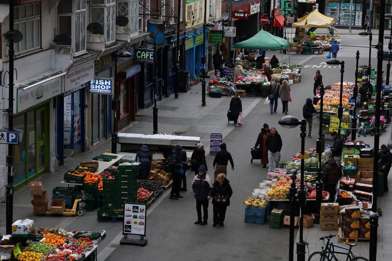 People walk through Surrey Street market in Croydon