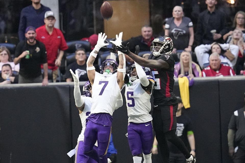 Minnesota Vikings cornerbacks Byron Murphy Jr. (7) and Mekhi Blackmon (5) break up a Hail Mary pass intended for Atlanta Falcons wide receiver Van Jefferson (15) during the second half of an NFL football game, Sunday, Nov. 5, 2023, in Atlanta. (AP Photo/Mike Stewart)