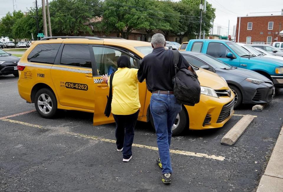 An Access driver guides a visually impaired man into a minivan parked outside Lighthouse For the Blind in Fort Worth on May 9, 2024. Access is a Trinity Metro ride-share service for the disabled.