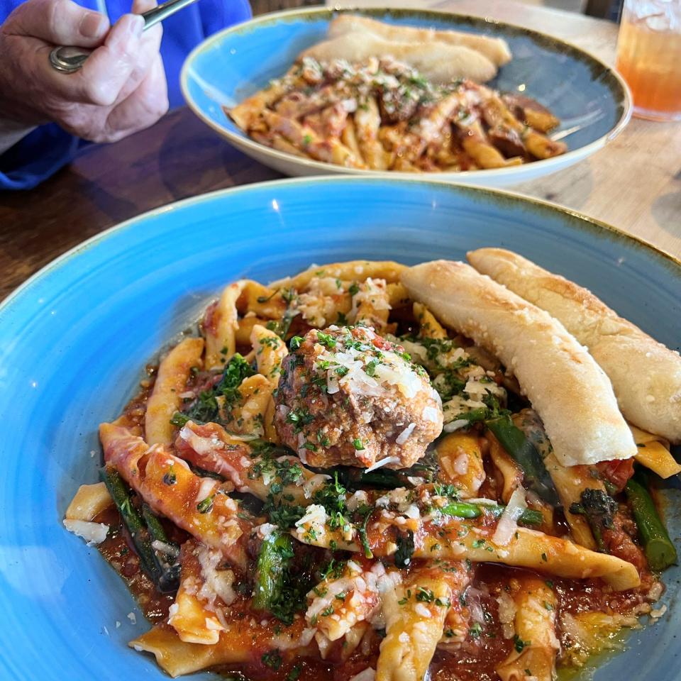 Picasso’s homemade penne pasta with spicy arrabbiata sauce, brocollini and meatball.