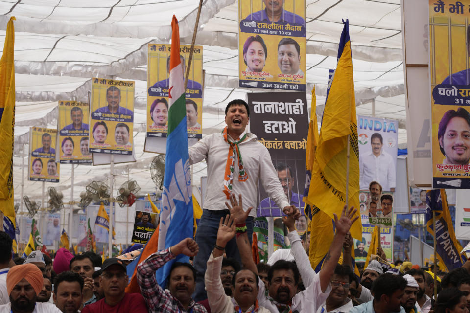 Supporters from various opposition parties shout anti government slogans during the 'Save Democracy' rally organized by INDIA bloc, a group formed by opposition parties, in New Delhi, India, Sunday, March 31, 2024. The "Save Democracy" rally was the first major public demonstration by the opposition bloc INDIA against the arrest of New Delhi's top elected official and opposition leader Arvind Kejriwal on March 21, in a liquor bribery case. (AP Photo/Manish Swarup)