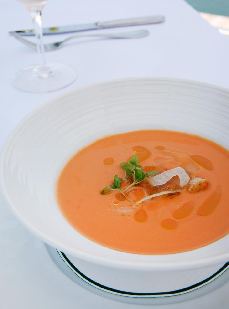 Le Bilboquet's gazpacho is accented with house-made croutons and micro basil.