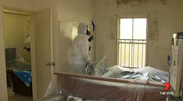 Mould Men work to remove the mould from the unit in Brisbane. Photo: 7 News