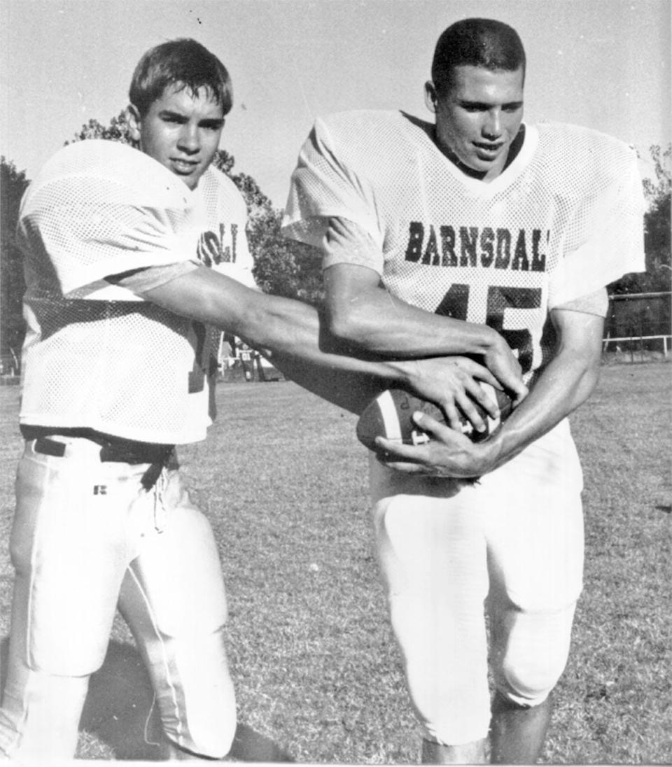 PANTHER TRADITION: Barnsdall High quarterback Will McCauley, left, practices giving a handoff to running back Heath Dahl during the 1996 season. Dahl was a 1,000-plus yard rusher in multiple seasons for Barnsdall.