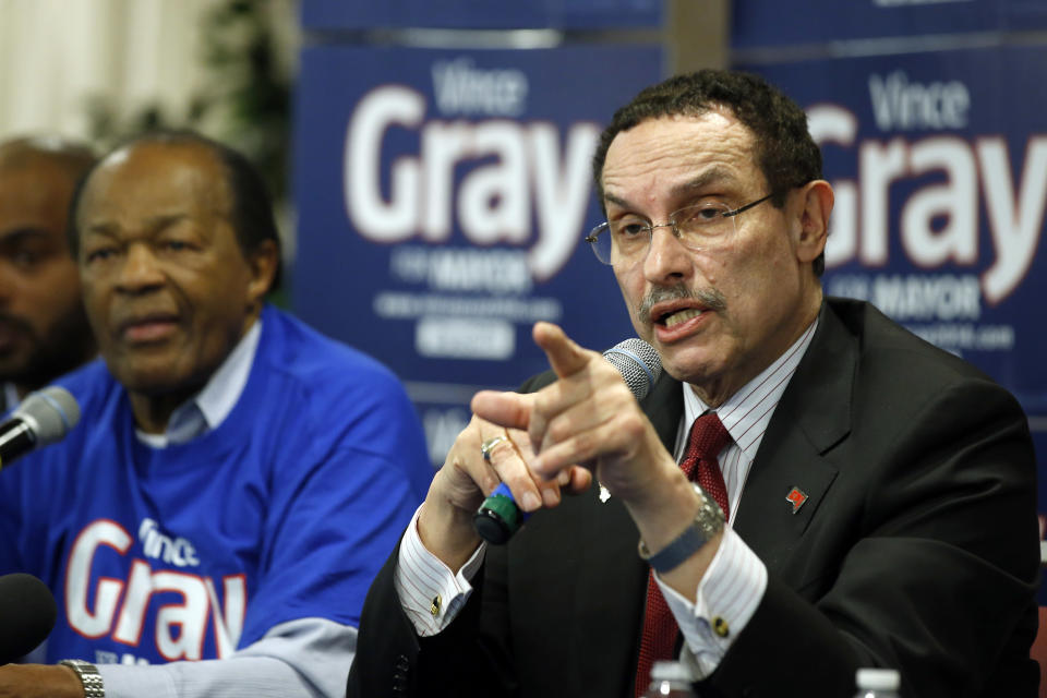 FILE - In this March 19, 2014, file photo, Mayor Vincent Gray answers a reporter's question during a media availability with former mayor and DC City Council member Marion Barry, left, in Washington. Gray was facing seven challengers in the city’s Democratic primary on April 1, 2014, which historically has decided the mayoral election in the overwhelmingly Democratic District of Columbia.(AP Photo/Alex Brandon)