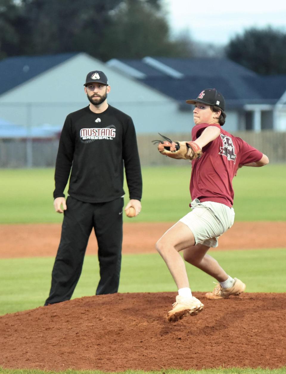 South Effingham pitching coach Jessie Osborne, a former Mustangs pitcher, gives some insight on pitching to Dru Futch.