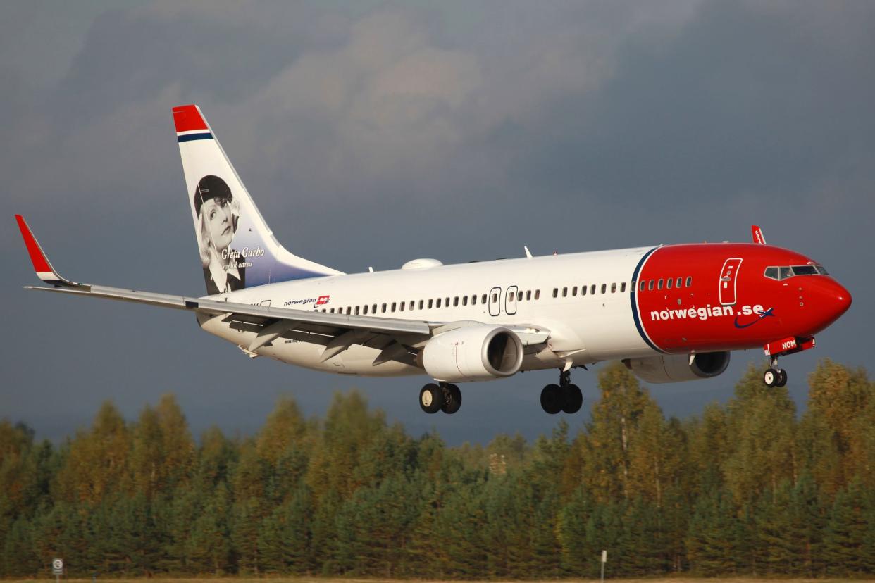 A Norwegian Boeing 737-800 with the registration LN-NOM and Greta Garbo on the tail approaches Oslo Airport (OSL) in Norway