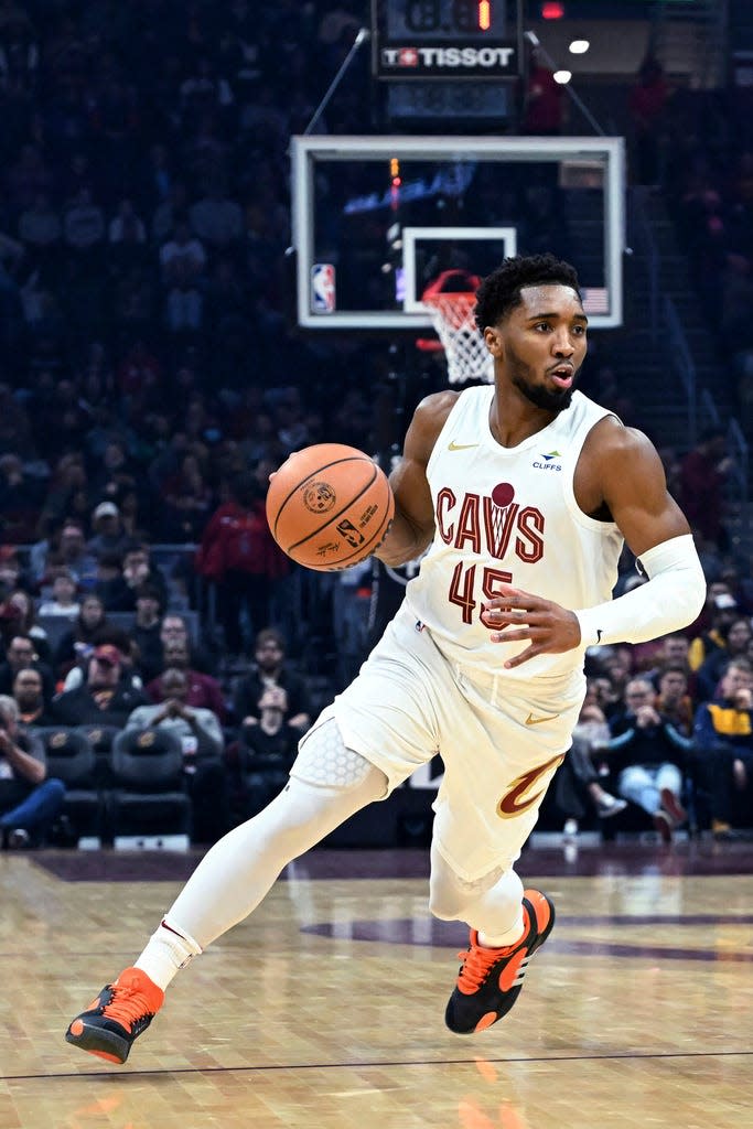 Cleveland Cavaliers' Donovan Mitchell drives during the first half of the team's NBA basketball game against the Washington Wizards, Friday, Jan. 5, 2024, in Cleveland. (AP Photo/Nick Cammett)