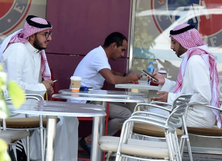 A picture taken on November 5, 2017 show men at a cafe in the Saudi capital Riyadh