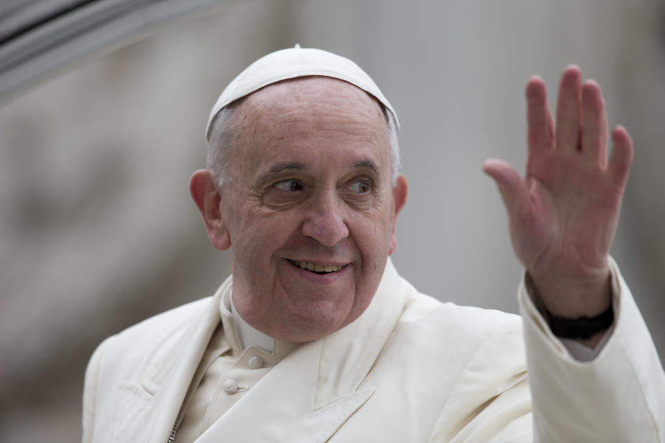 Pope Francis waves as he leaves at the end of his weekly general audience in St. Peter's Square at the Vatican, Wednesday, Feb. 5, 2014. A U.N. human rights committee denounced the Vatican on Wednesday for “systematically” adopting policies that allowed priests to rape and molest tens of thousands of children over decades, and urged it to open its files on the pedophiles and the bishops who concealed their crimes. (AP Photo/Alessandra Tarantino)