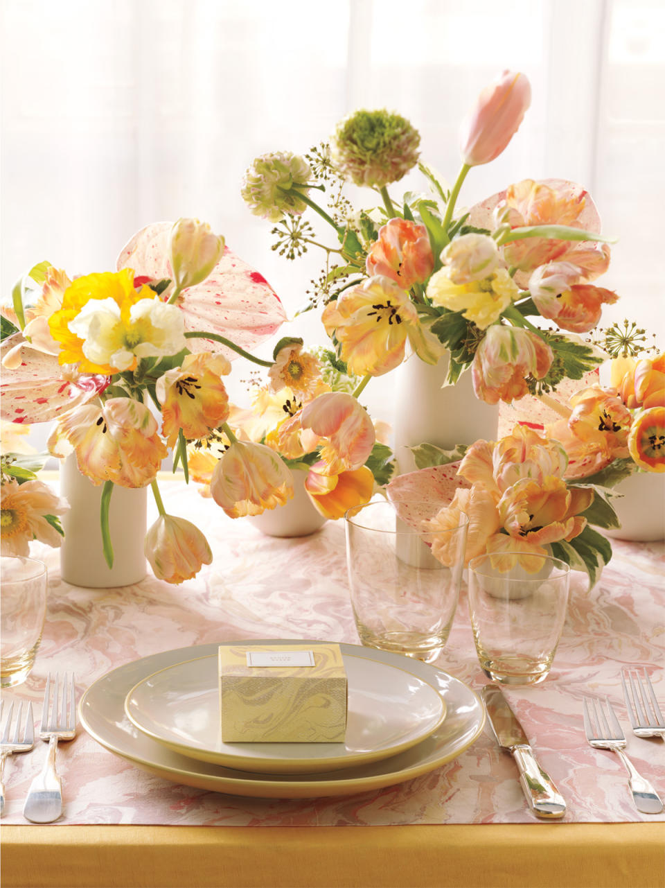 This 2013 publicity photo provided by courtesy of Martha Stewart Living Omnimedia, Inc. shows a Weddings Hybrid, Spring 2013, centerpiece, originally published in the spring issue of Martha Stewart Weddings magazine. Combining rusticity and elegance is a modern trend in wedding receptions. Flowers can have a less formal presentation, and seating can be more casual. (AP Photo/Martha Stewart Living Omnimedia, Inc., Patricia Heal)