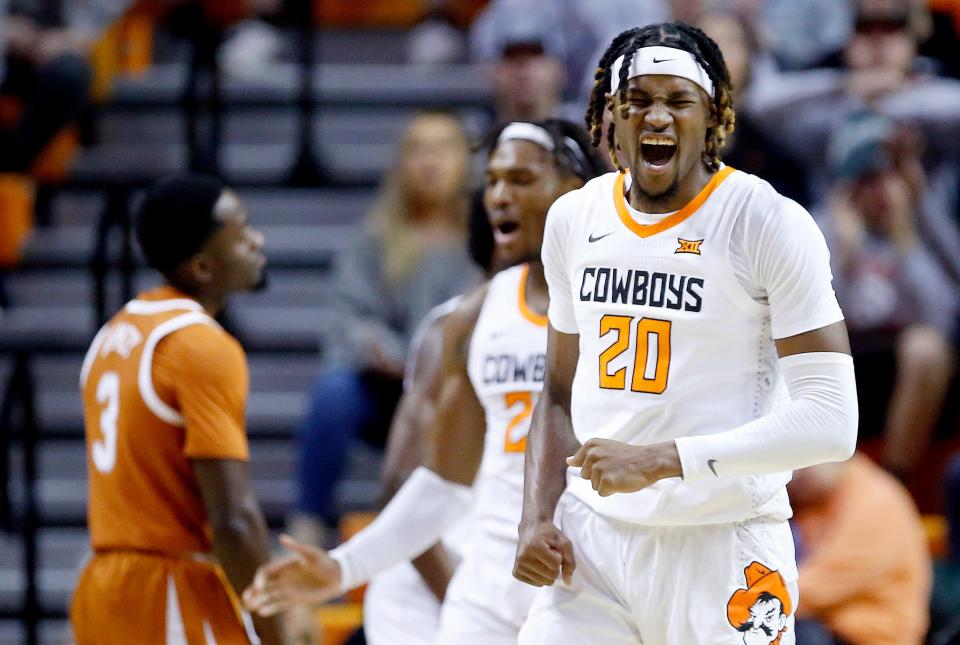 Oklahoma State's Keylan Boone (20) celebrates a Texas turnover in the first half of a 64-51 win Saturday in Stillwater.