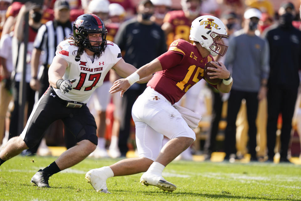 Iowa State quarterback Brock Purdy (15) runs from Texas Tech linebacker Colin Schooler (17) during the first half of an NCAA college football game, Saturday, Oct. 10, 2020, in Ames, Iowa. (AP Photo/Charlie Neibergall)